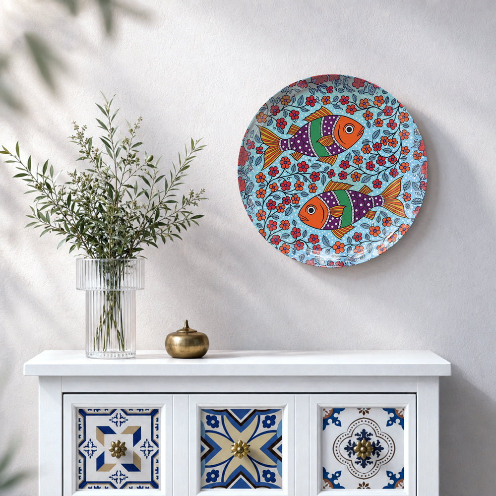 Colorful fish ceramic wall plate with floral folk art design for Indian-inspired home decor