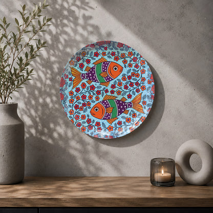 Folk art fish ceramic wall decor plate with vibrant blue, orange, red and purple artwork