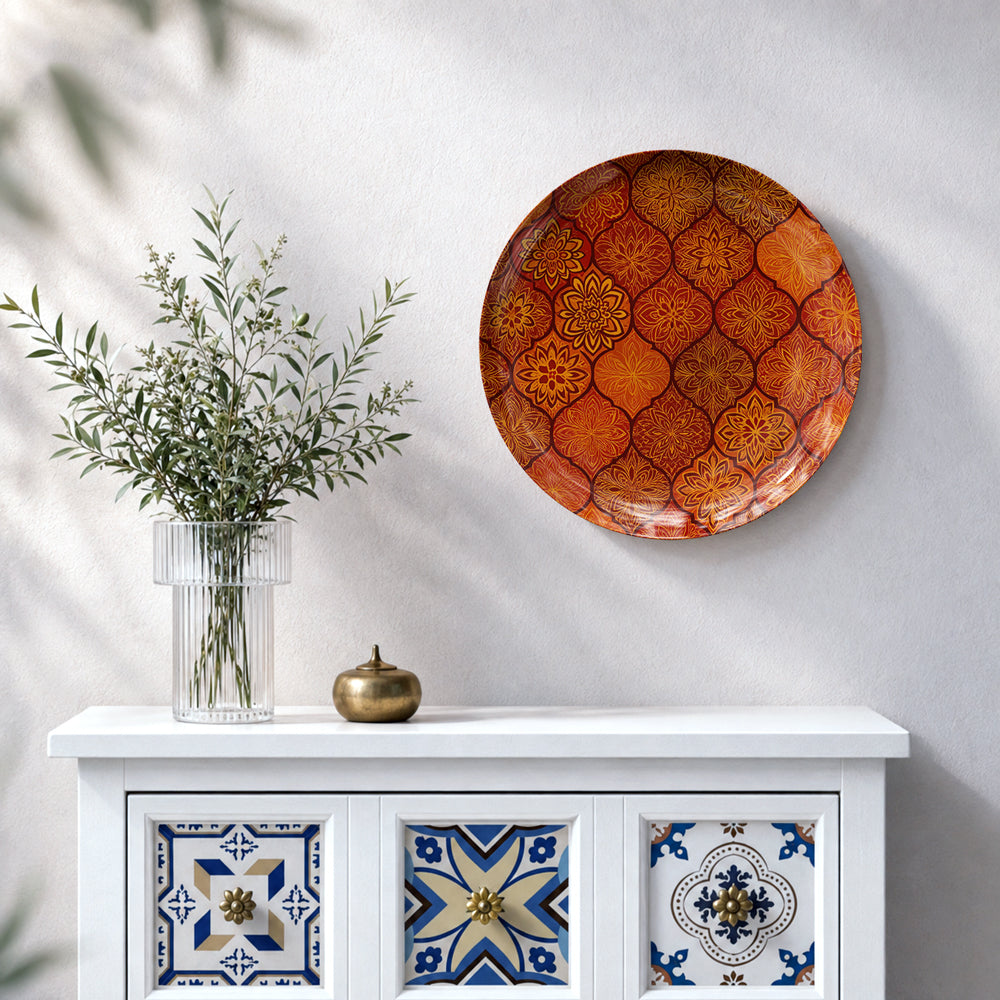 Indian decorative ceramic wall plate featuring repeated floral motifs and intricate ornamental linework