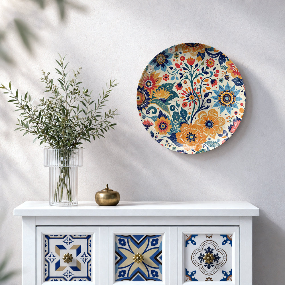 Colourful floral ceramic wall plate featuring intricate flowers, leaves and flowing botanical vines