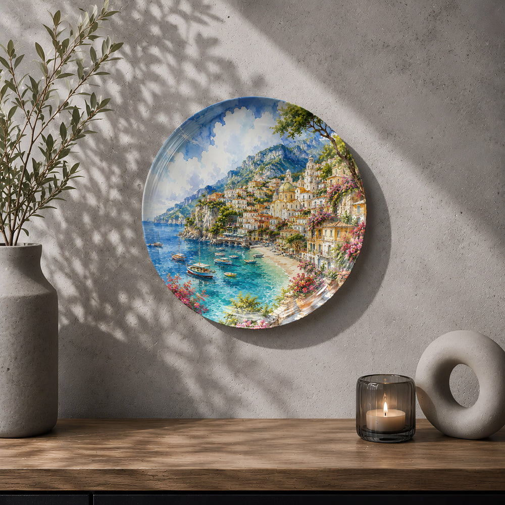 Decorative ceramic wall plate with artwork of the scenic Amalfi Coast and Mediterranean shoreline.
