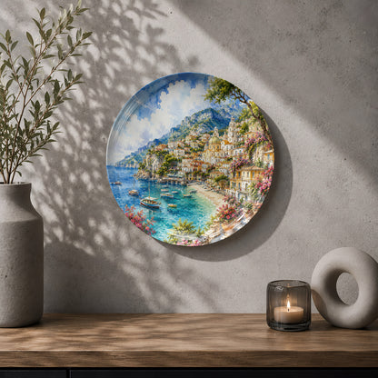Decorative ceramic wall plate with artwork of the scenic Amalfi Coast and Mediterranean shoreline.
