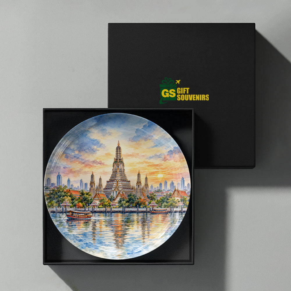 Bangkok ceramic wall plate featuring Wat Arun, traditional boats, river reflections and warm evening sky