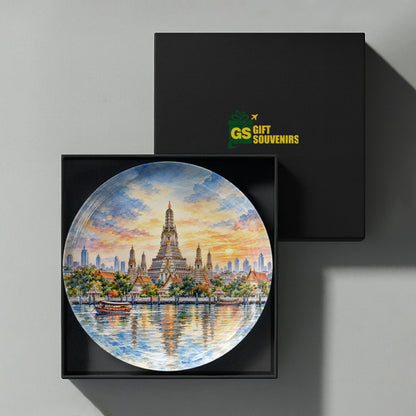 Bangkok ceramic wall plate featuring Wat Arun, traditional boats, river reflections and warm evening sky