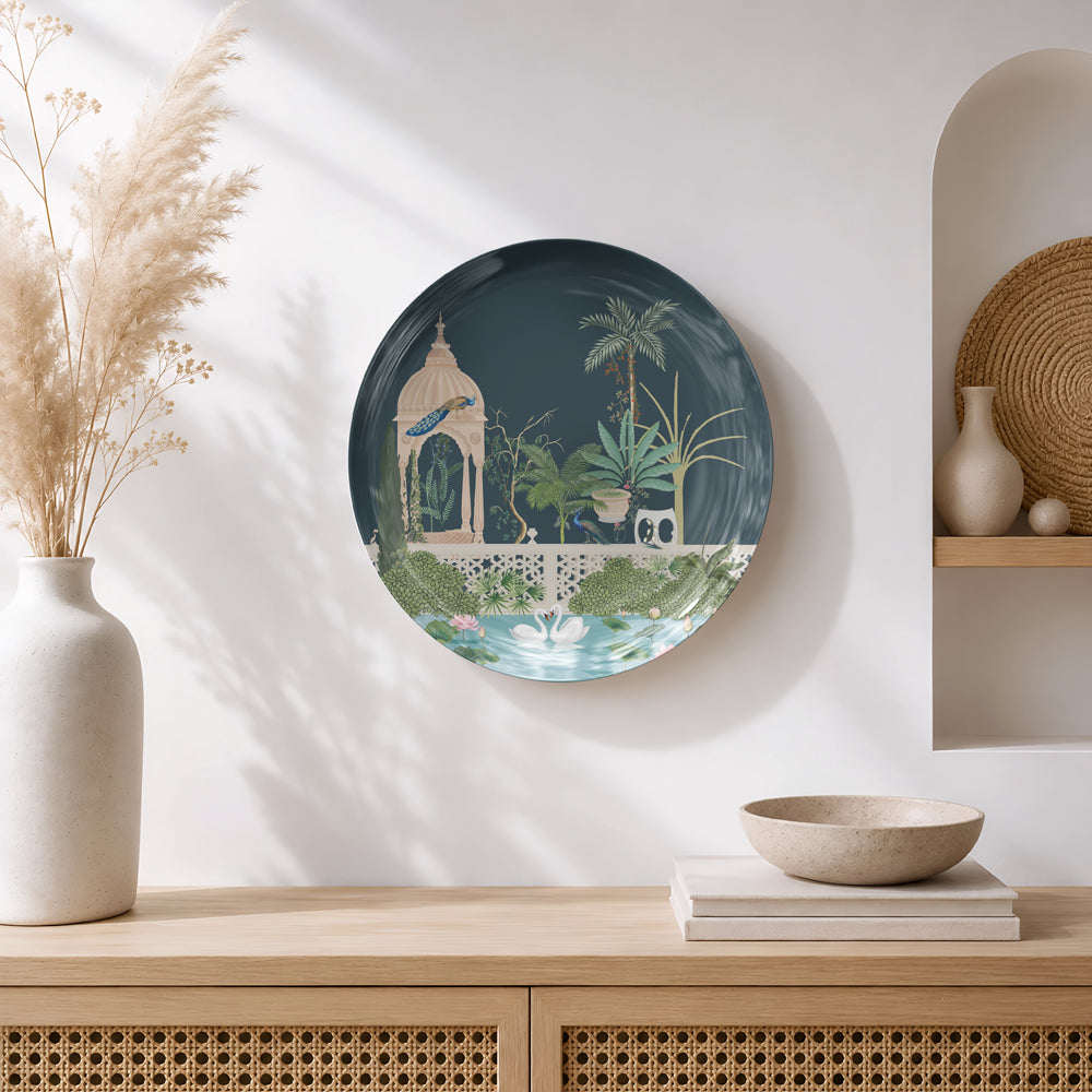 Premium glossy ceramic wall plate depicting a tranquil palace garden with peacocks, lotus flowers and ornamental plants.