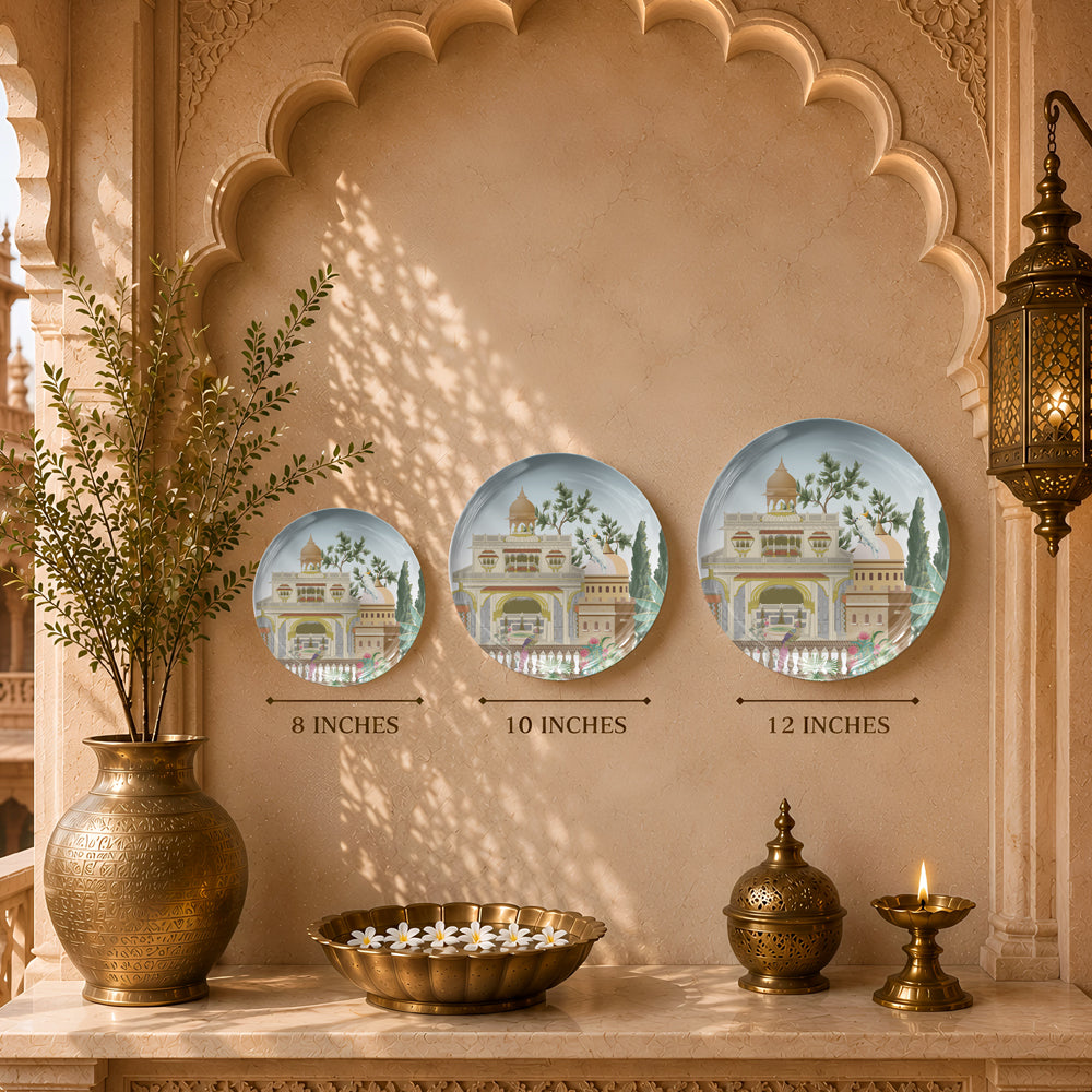 Decorative ceramic wall plate featuring traditional Indian palace architecture and botanical landscape artwork.
