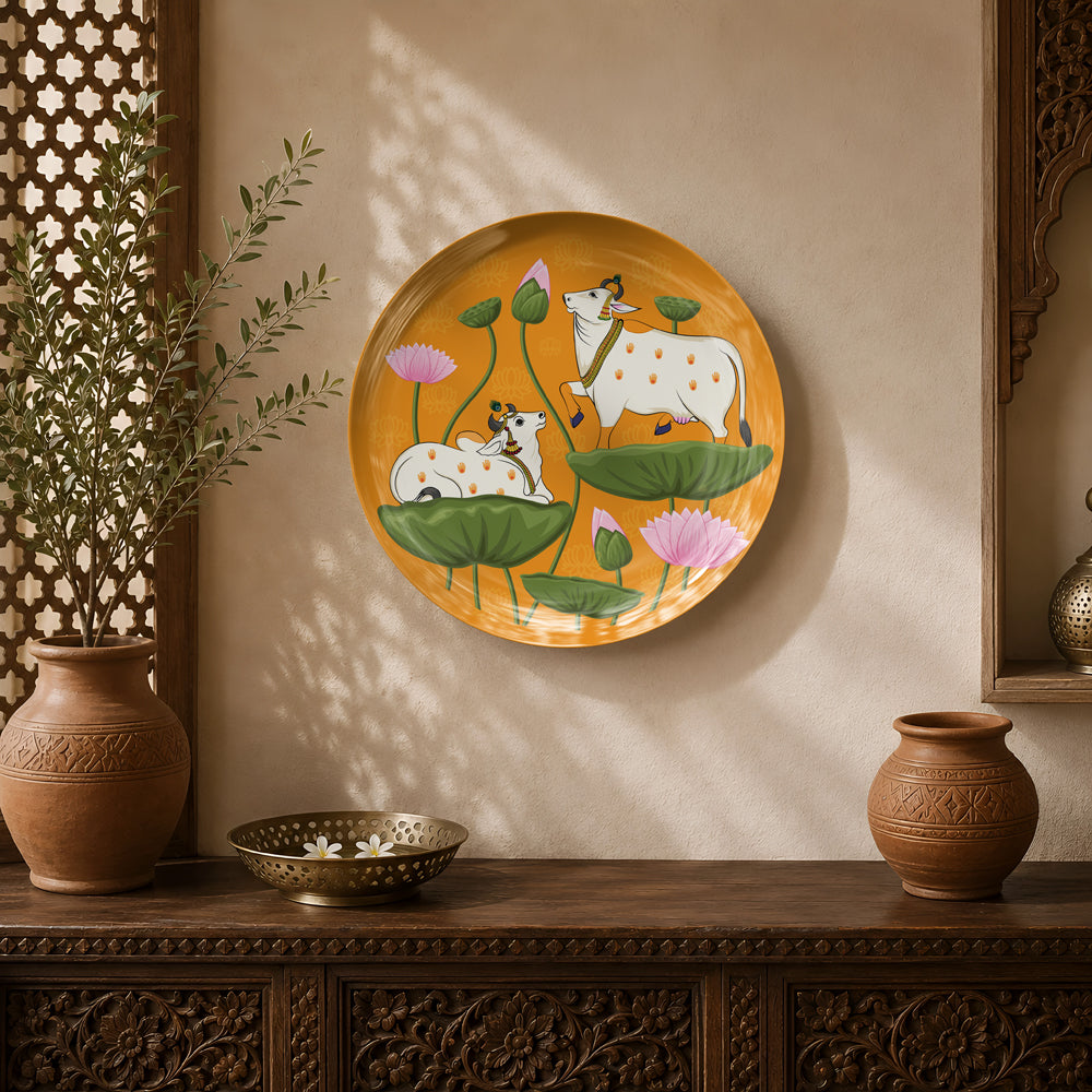 Lotus Pastures ceramic wall plate featuring sacred cows resting among blooming lotus flowers inspired by Pichwai art.