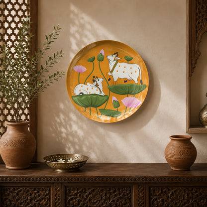 Lotus Pastures ceramic wall plate featuring sacred cows resting among blooming lotus flowers inspired by Pichwai art.