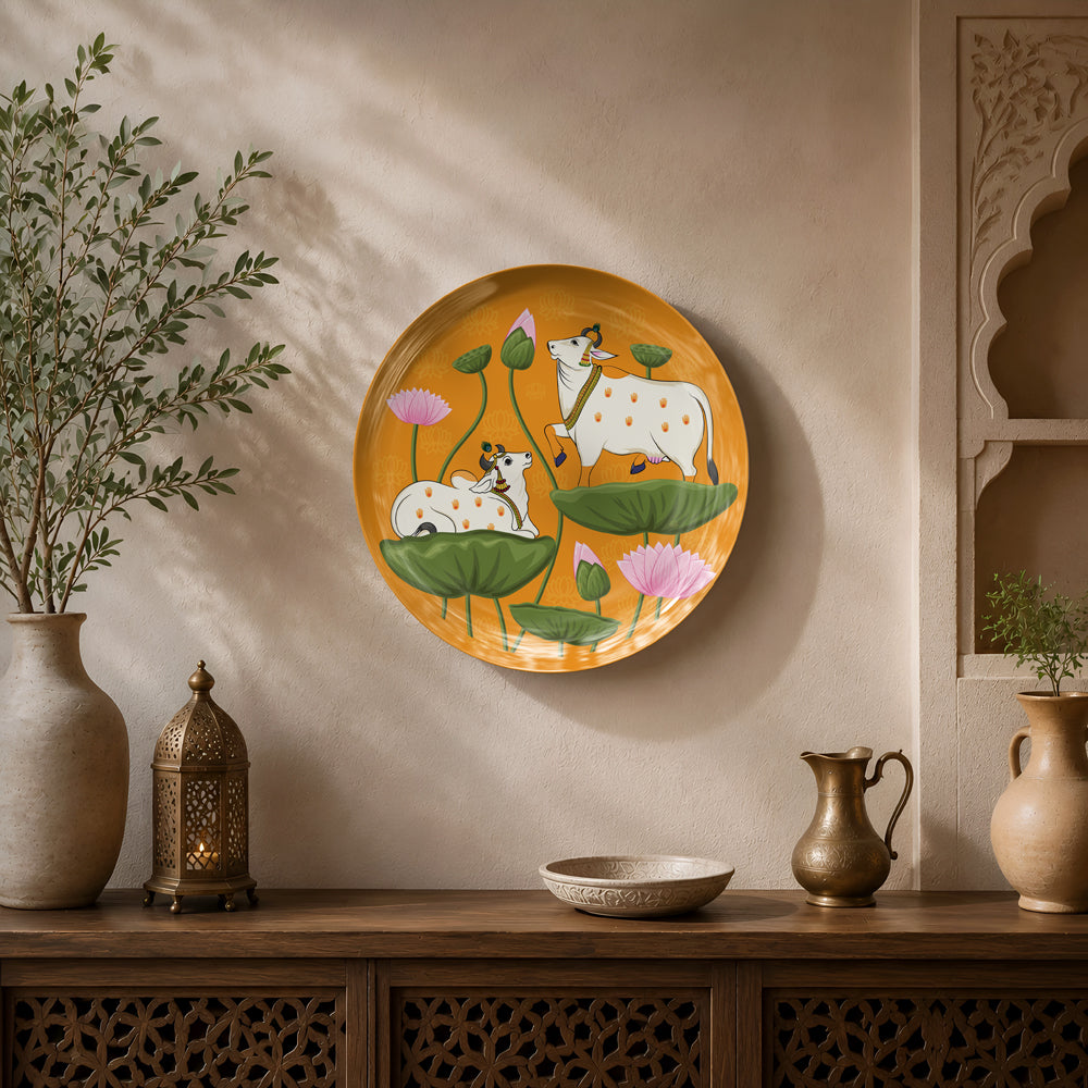 Premium ceramic wall plate inspired by Indian Pichwai paintings with sacred cows and vibrant lotus blooms.