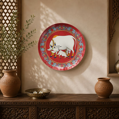Sacred Bond ceramic wall plate featuring a sacred cow and calf inspired by traditional Pichwai art.