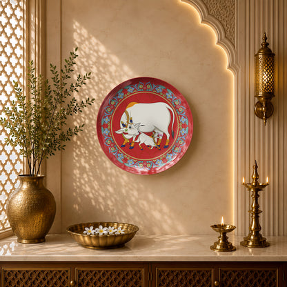Indian Heritage Series ceramic wall plate featuring a sacred cow nurturing her calf in traditional Indian folk art.
