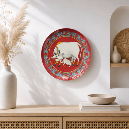 Luxury ceramic wall plate featuring traditional Pichwai-inspired Gau Mata artwork with intricate floral detailing.