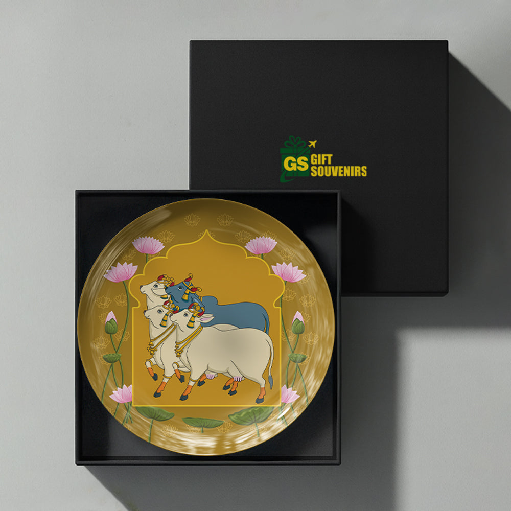 Sacred Companions premium ceramic wall plate celebrating India's artistic heritage with lotus flowers and sacred cow artwork.