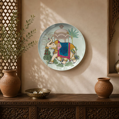 Elephant of the Court ceramic wall plate featuring a decorated ceremonial elephant in a royal palace garden.