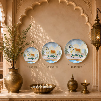 Decorative ceramic wall plate featuring a traditional sacred cow with elegant Indian palace architecture.