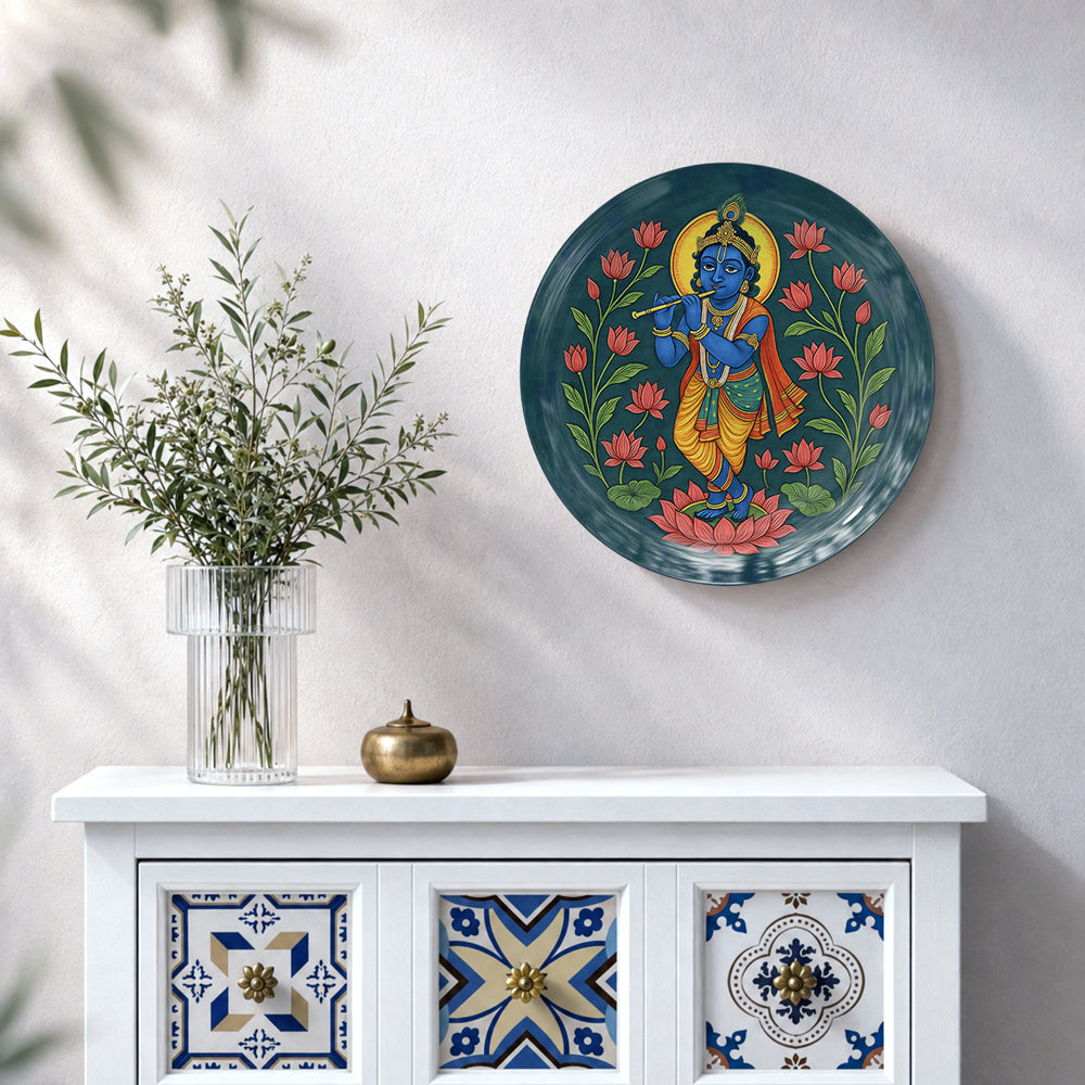 Krishna ceramic wall plate featuring blue Krishna, flute and vibrant pink lotus flowers