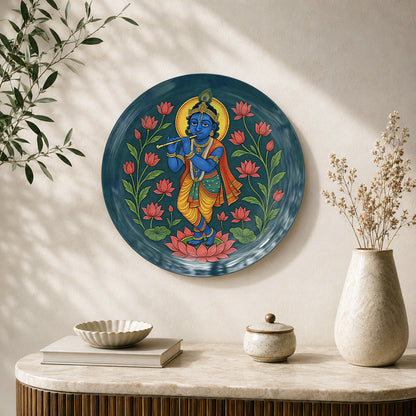 Sacred Symphony Krishna ceramic wall plate featuring Lord Krishna playing flute among lotus flowers