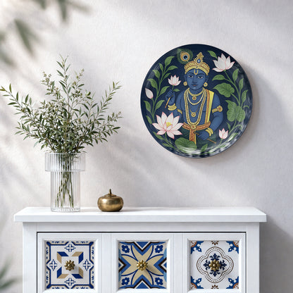 Krishna ceramic wall plate featuring blue Krishna, traditional ornaments and vibrant lotus flowers
