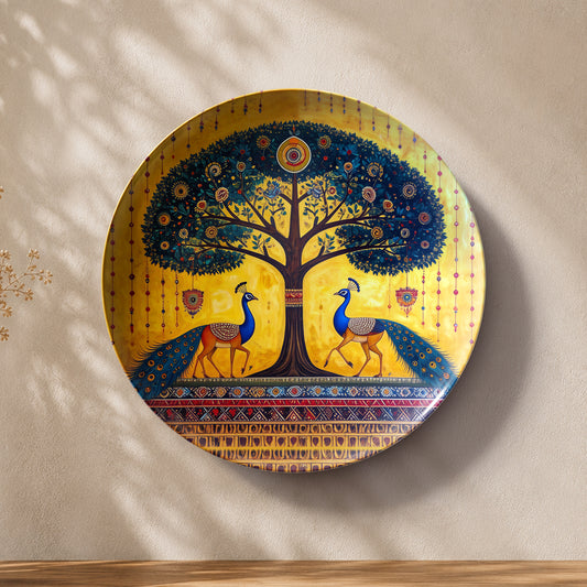 Glossy ceramic wall plate featuring two peacocks beneath a vibrant golden and blue Tree of Life artwork.