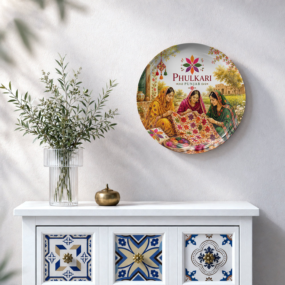 Punjabi women creating colourful Phulkari embroidery on a Punjab heritage ceramic wall plate