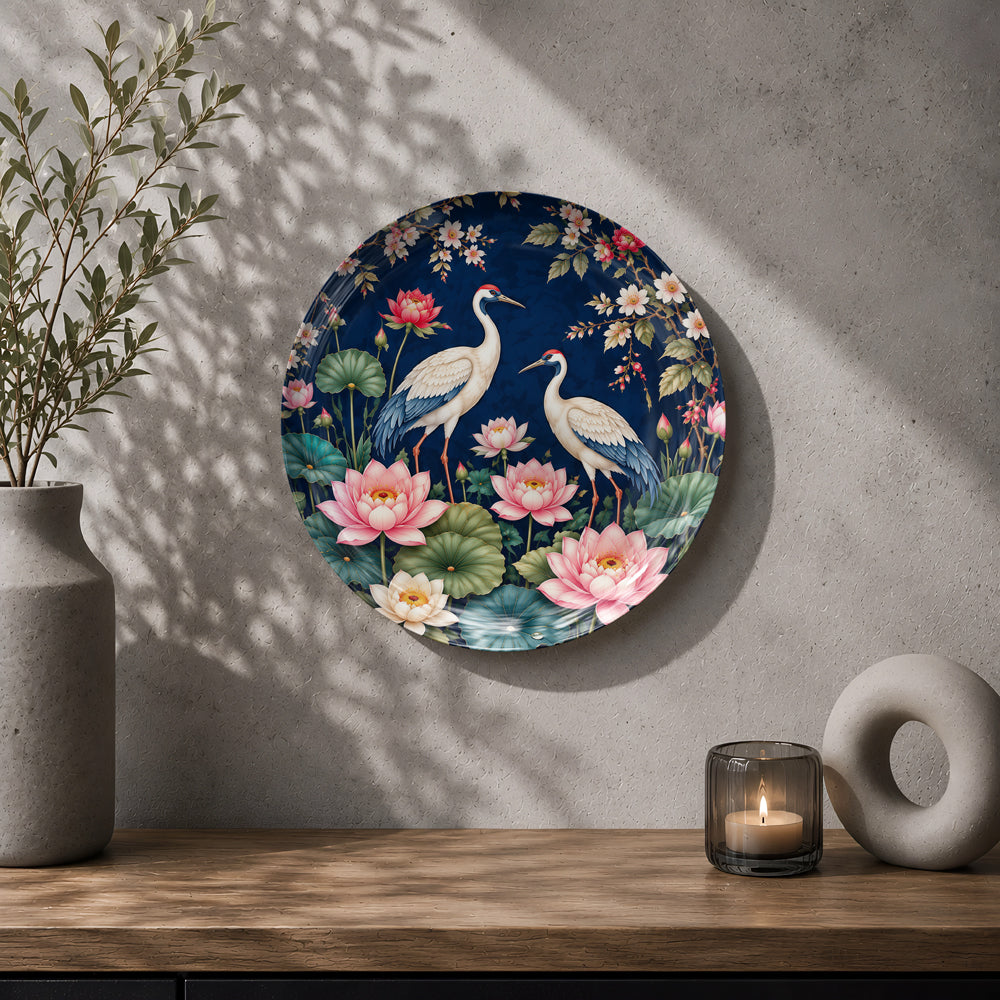 Twin cranes floral ceramic souvenir plate with a midnight-blue background and green lily pads