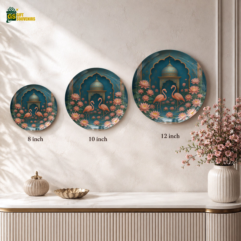 Glossy ceramic wall plate showcasing two flamingos surrounded by lotus blossoms in rich teal and coral tones.