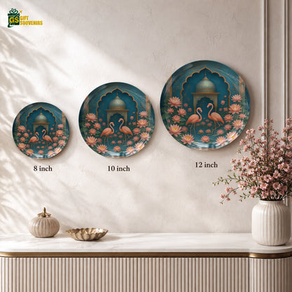 Glossy ceramic wall plate showcasing two flamingos surrounded by lotus blossoms in rich teal and coral tones.