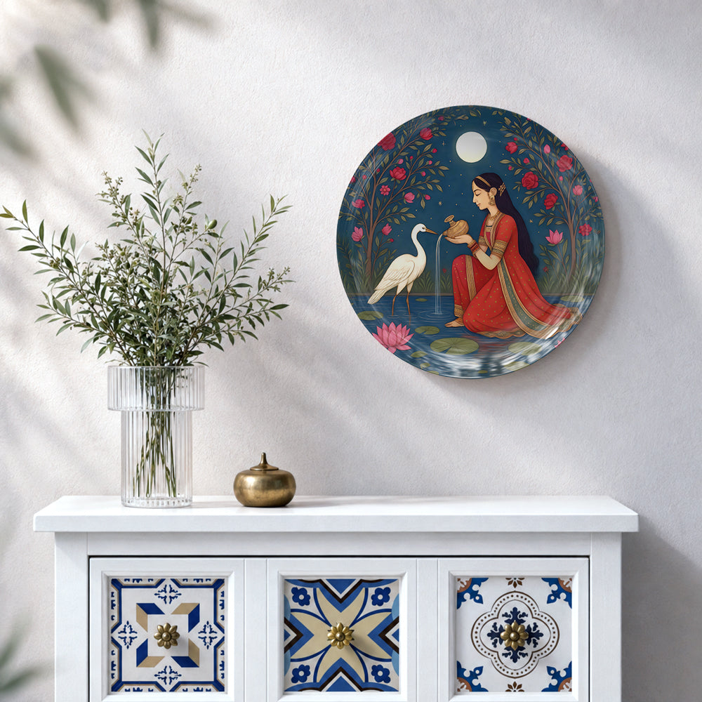 Indian-inspired ceramic wall plate featuring a graceful woman seated beside white cranes under a luminous moon.